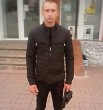 николай